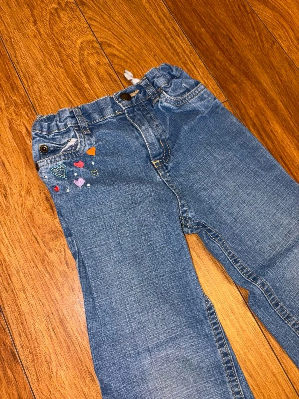 Y2K denim jeans with embroidered hearts